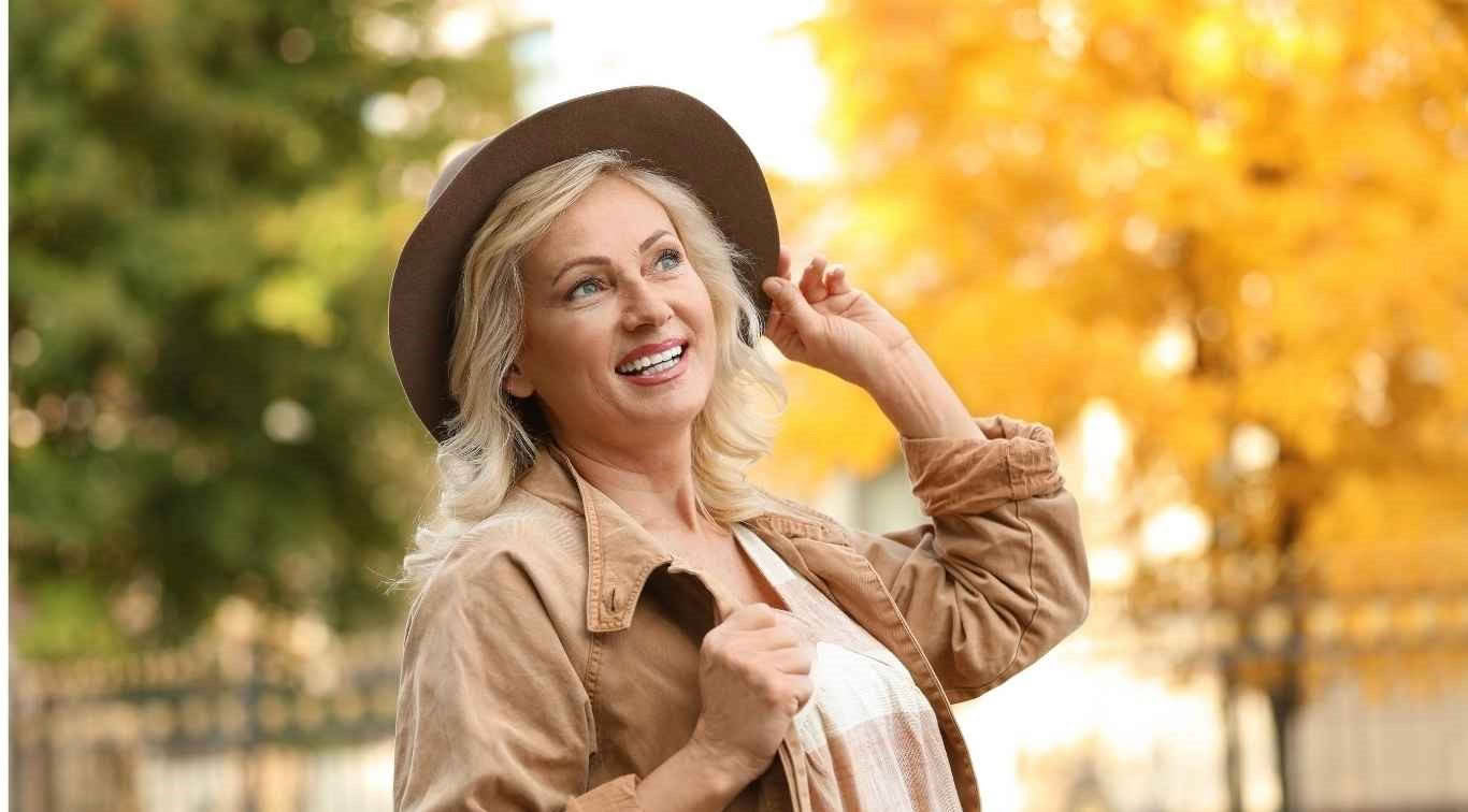 Happy confident woman enjoying life to the full - image